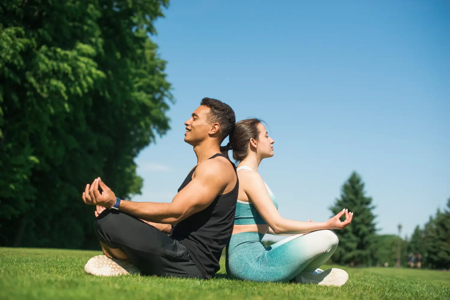 man-woman-practicing-yoga-outdoor man-woman-practicing-yoga-outdoor